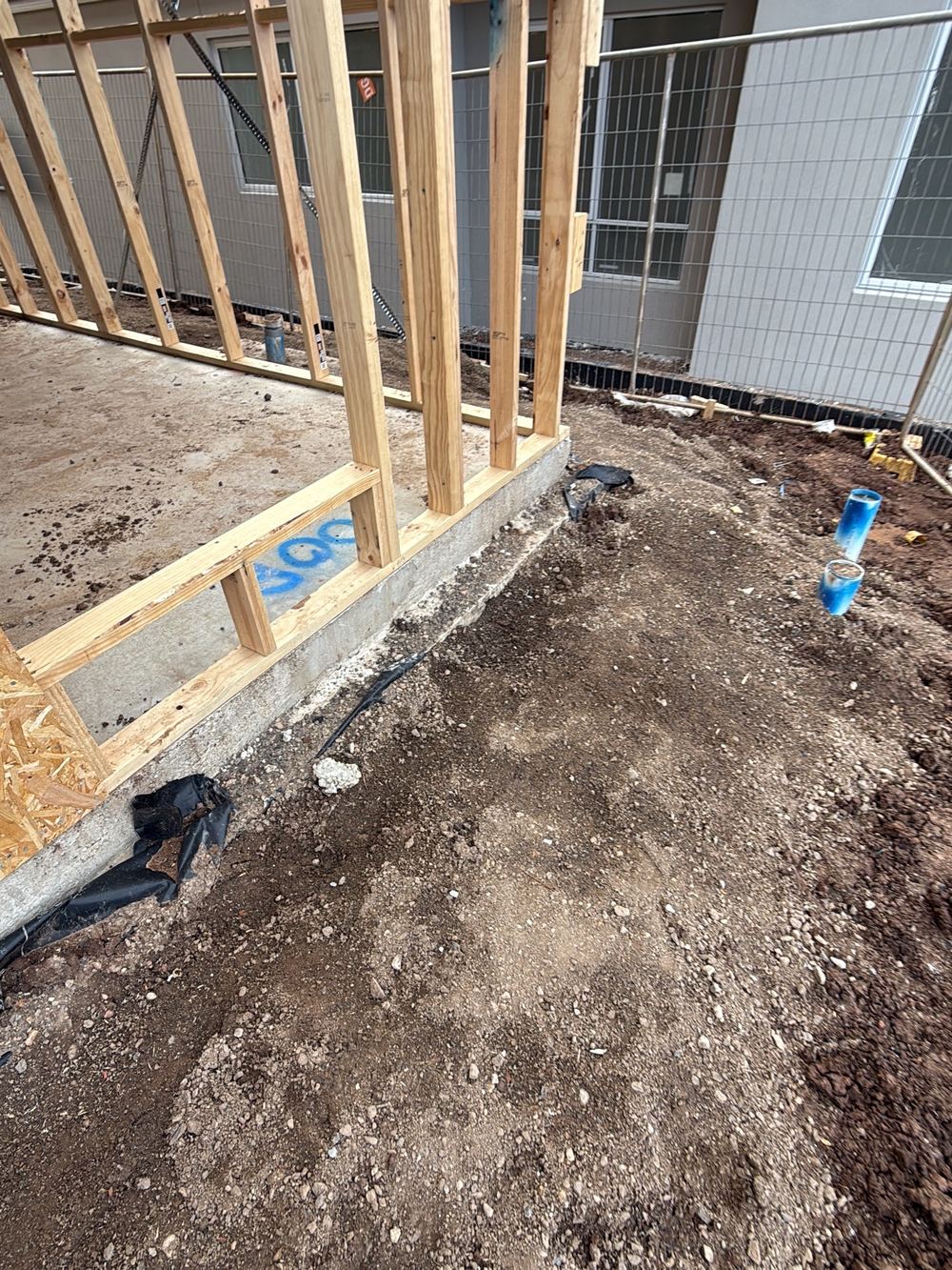 Vapour barrier not showing at ground level around the slab perimeter, Sunbury
