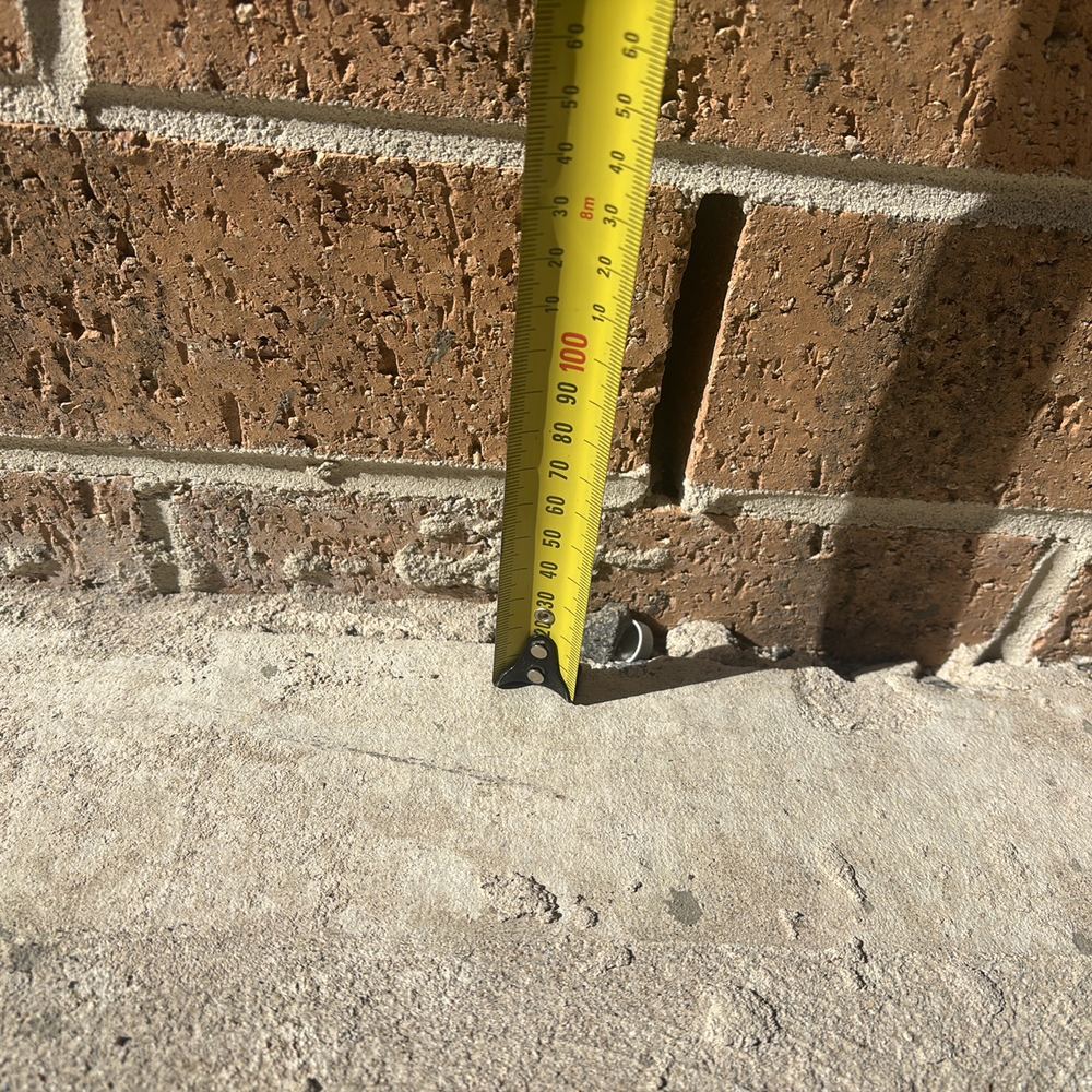 Weep holes sitting too close to the finished ground outside, found during a pre-handover inspection in Sunbury