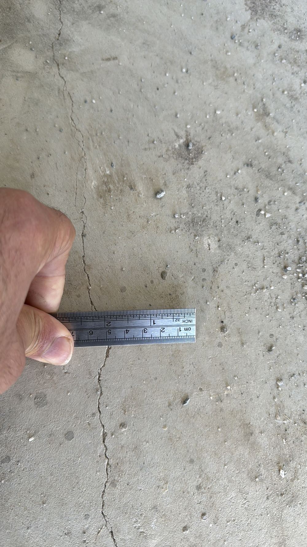 Slab cracks between 2mm and 4mm wide, beyond the tolerance, found during a pre-purchase inspection in Wallan