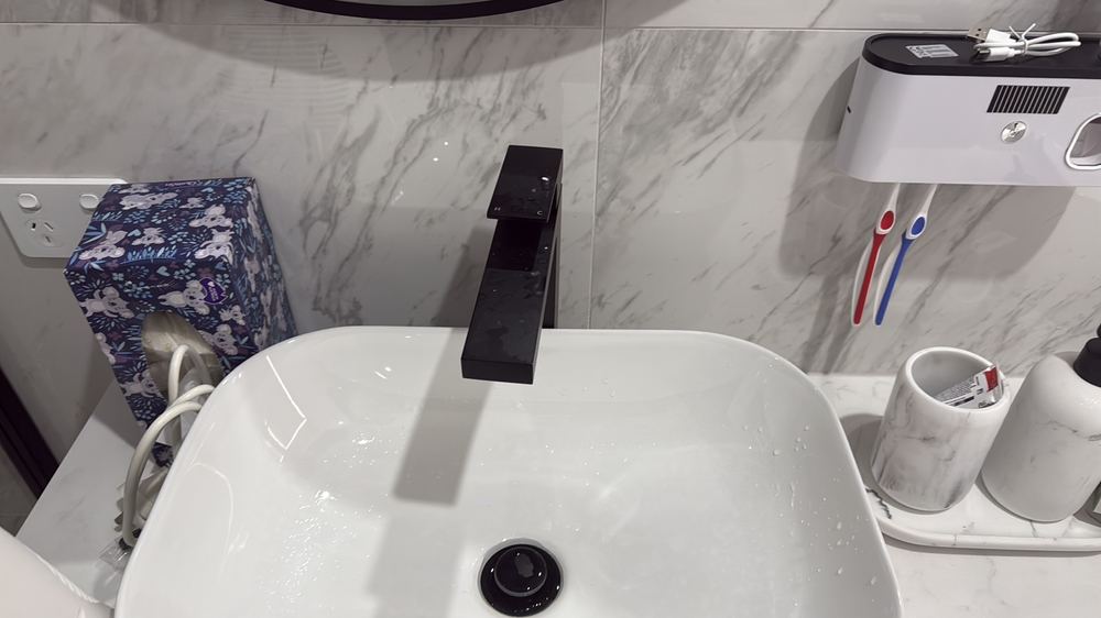 Kitchen mixer tap loose on the bench, a future leak point, found during a pre-purchase inspection in Wallan