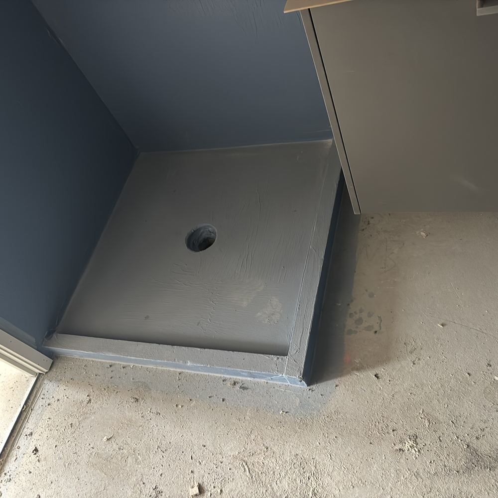 Fresh shower membrane left open to passing trades before tiling, found during a construction stage inspection in Sunbury